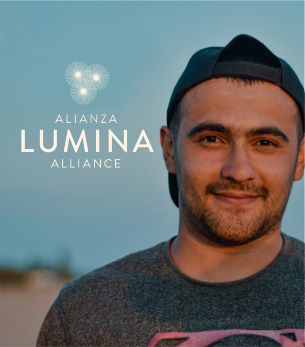 Lumina logo over Image of a man pictured front profile smiling.