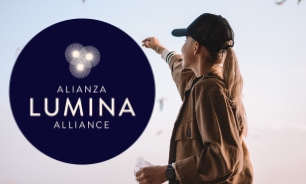 Lumina logo over Image of a woman grabbing something in the air looking away.