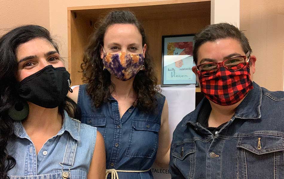 Selfie of three Lumina staff members, all with face masks on.