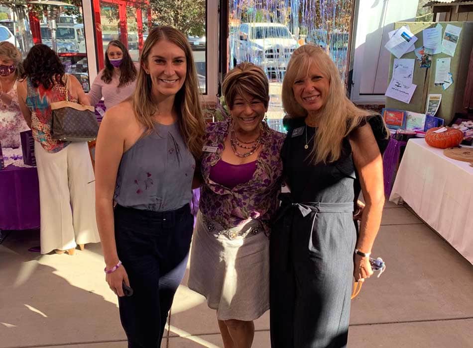 Erika Neel, Director of Donor Relations and Jennifer Adams, Chief Executive Officer pictured with a community member at an event.