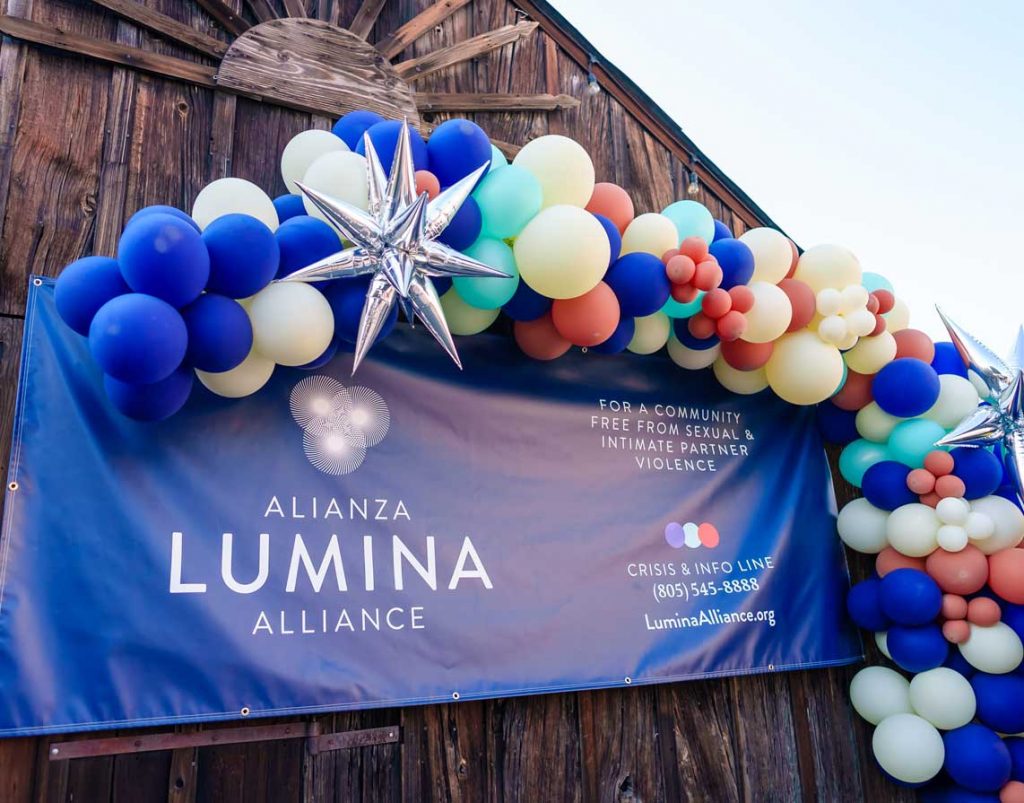 Lumina Alliance banner with a big balloon arch.