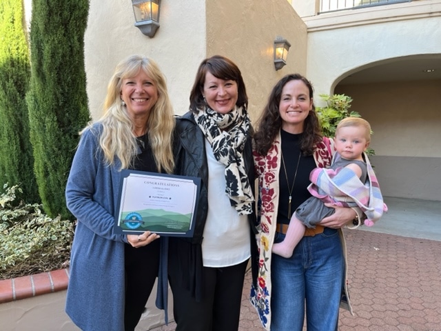 Lumina Alliance admin team members accepting the SLO County Family-Friendly Workplace award.