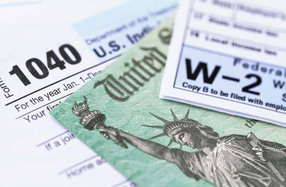 A 1040 form, a W-2. amd a certificate that has the Statue of Liberty and says United States on it.